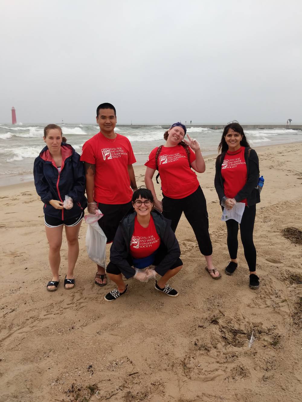 Group of students from the GVSU Soil and Water Conservation Society helping out at Beach Clean Up